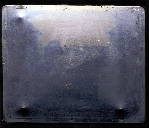 View from the Window at Le Gras, 1826 or 1827. This first-ever permanent photograph was captured in oil-treated bitumen on a pewter plate by Joseph Nicéphore Niépce in 1827 in Saint-Loup-de-Varennes, France. [2] Source: PetaPixel